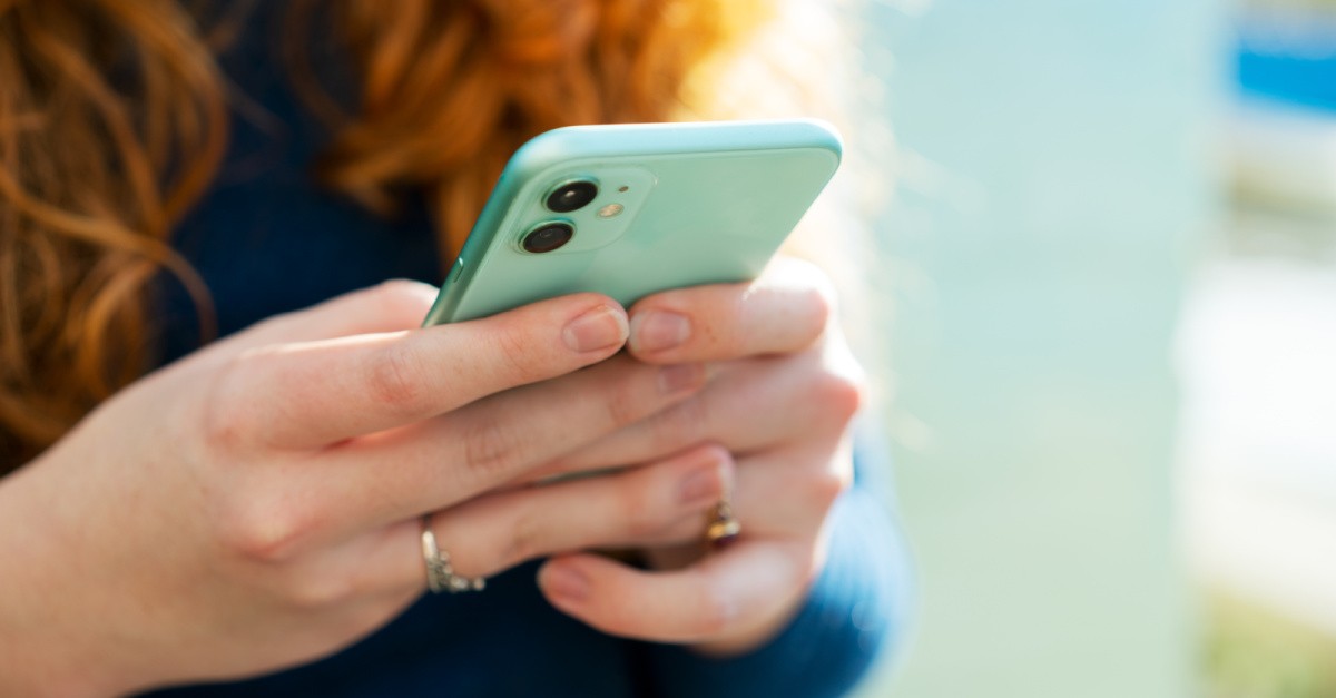 woman holding a phone,