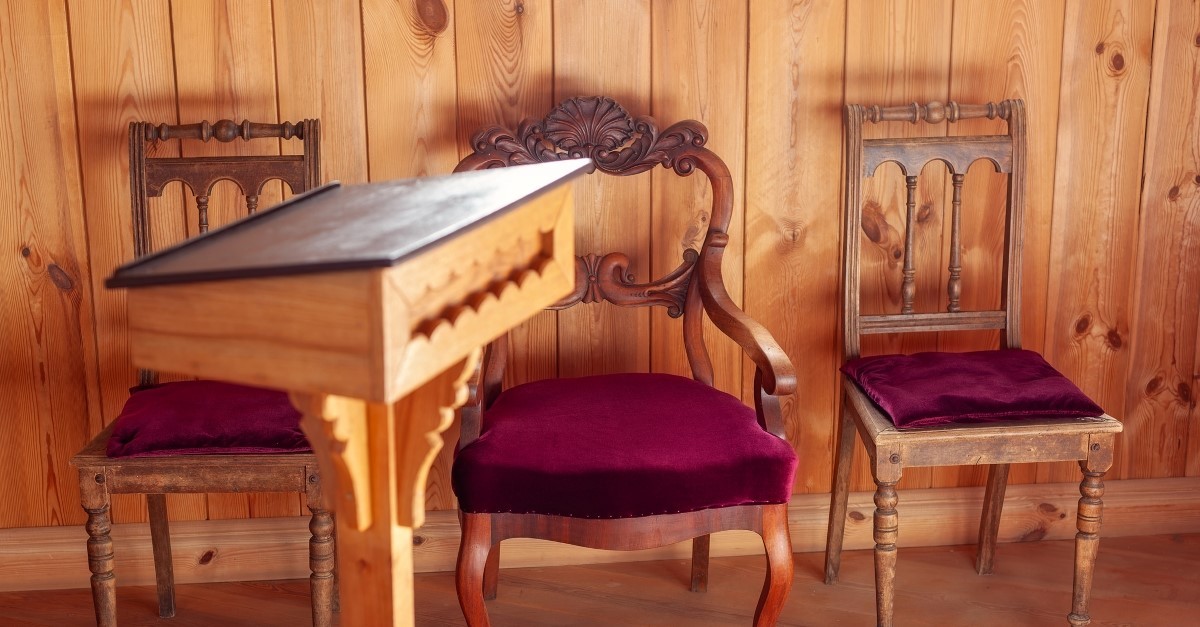 ornate seat by pastor's pulpit