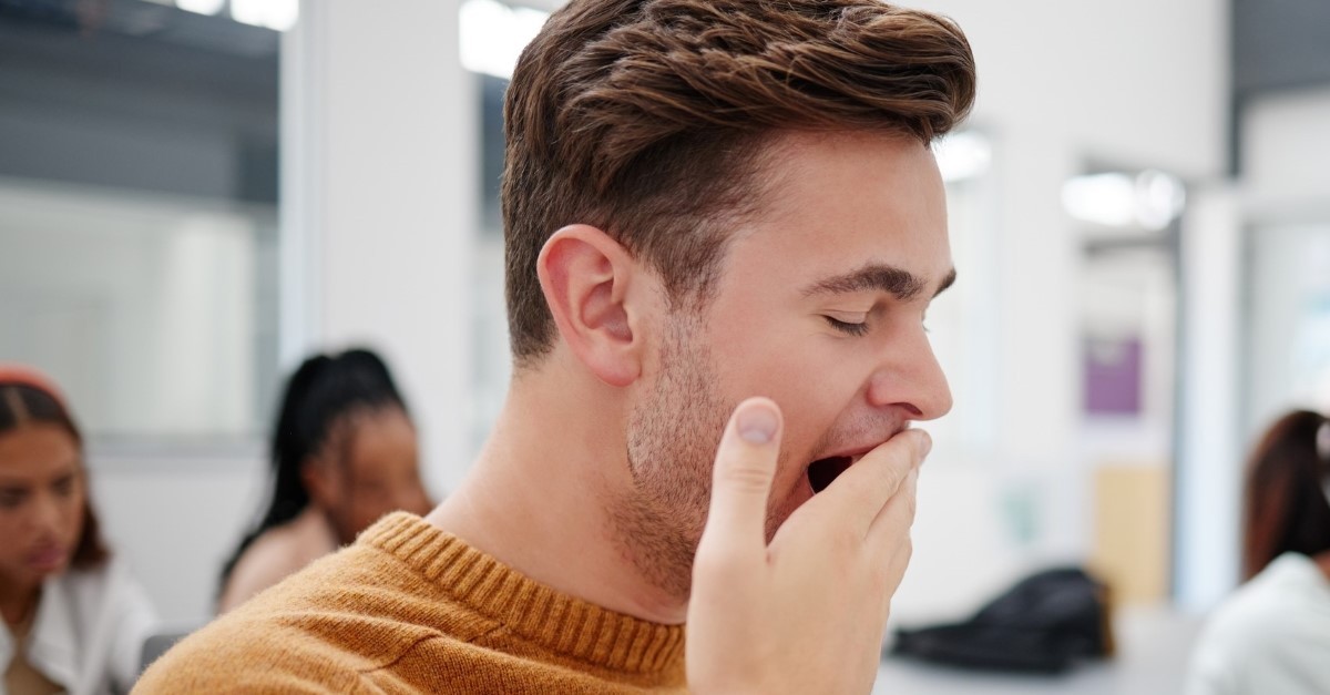 man yawning long church announcements outdated church traditions that need to go