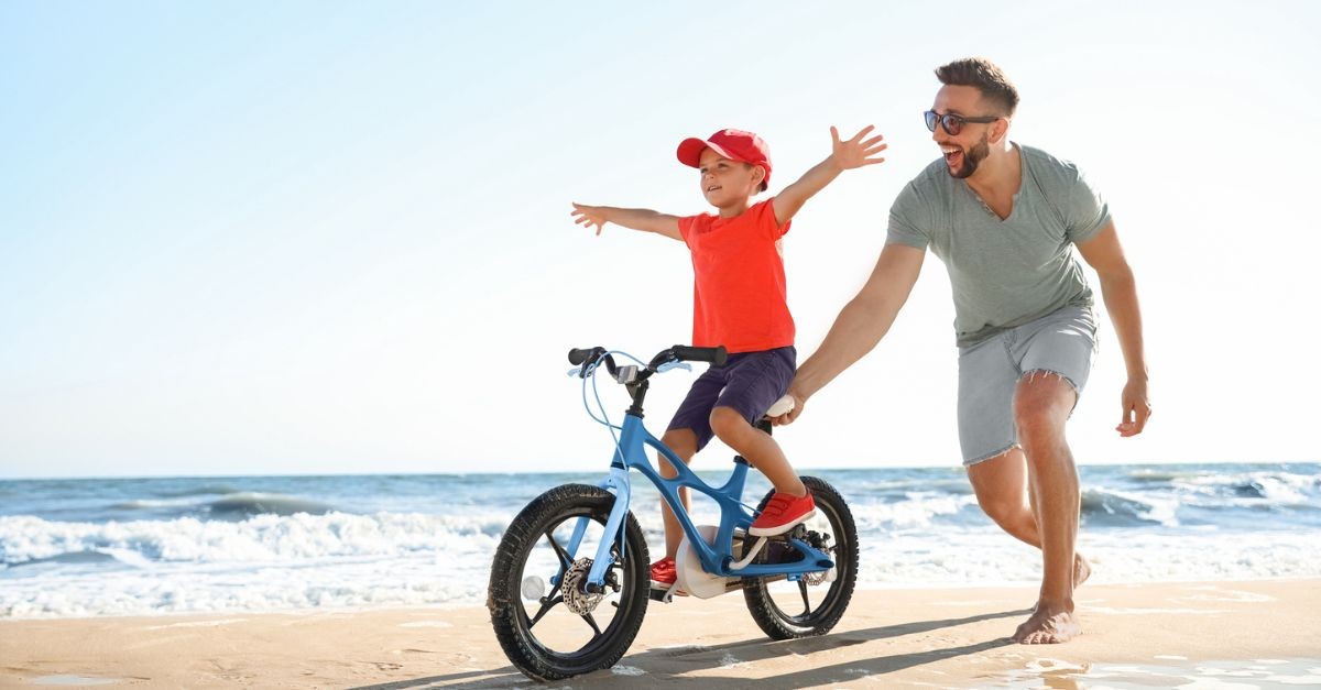 Man teaching a young boy to ride a bike; what is a godly man?