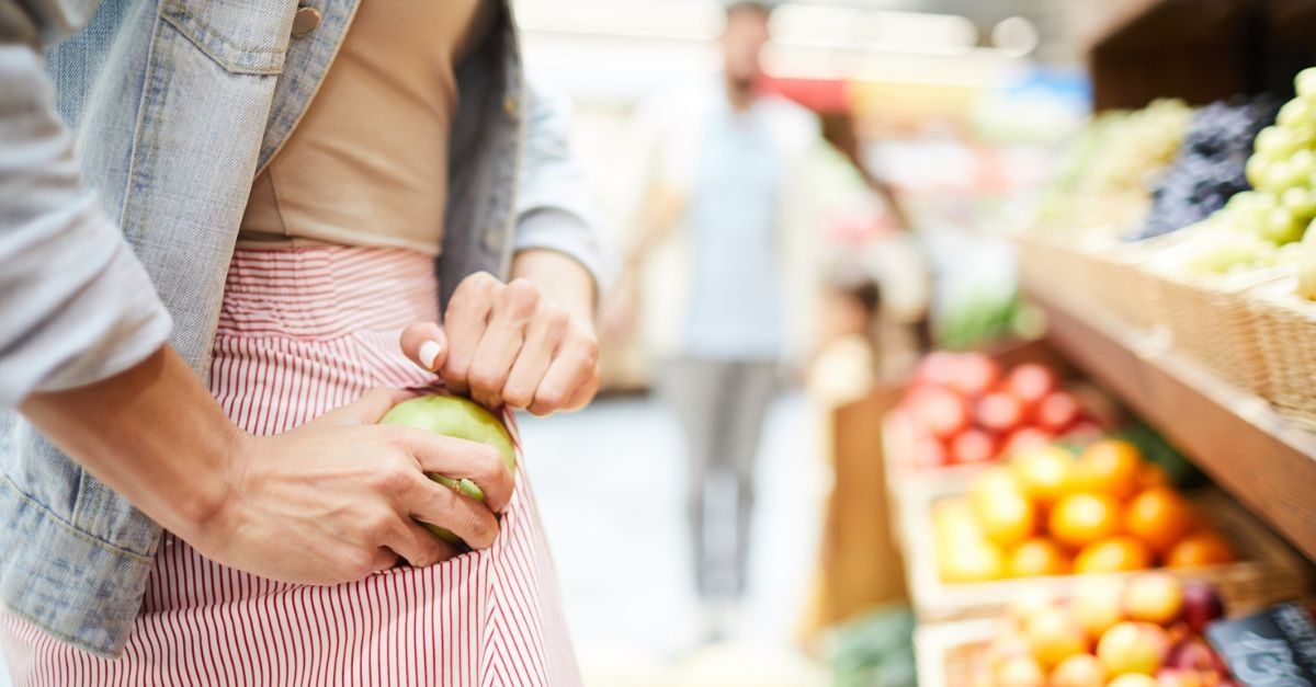 Woman stealing an apple; modern meaning of the 10 Commandments